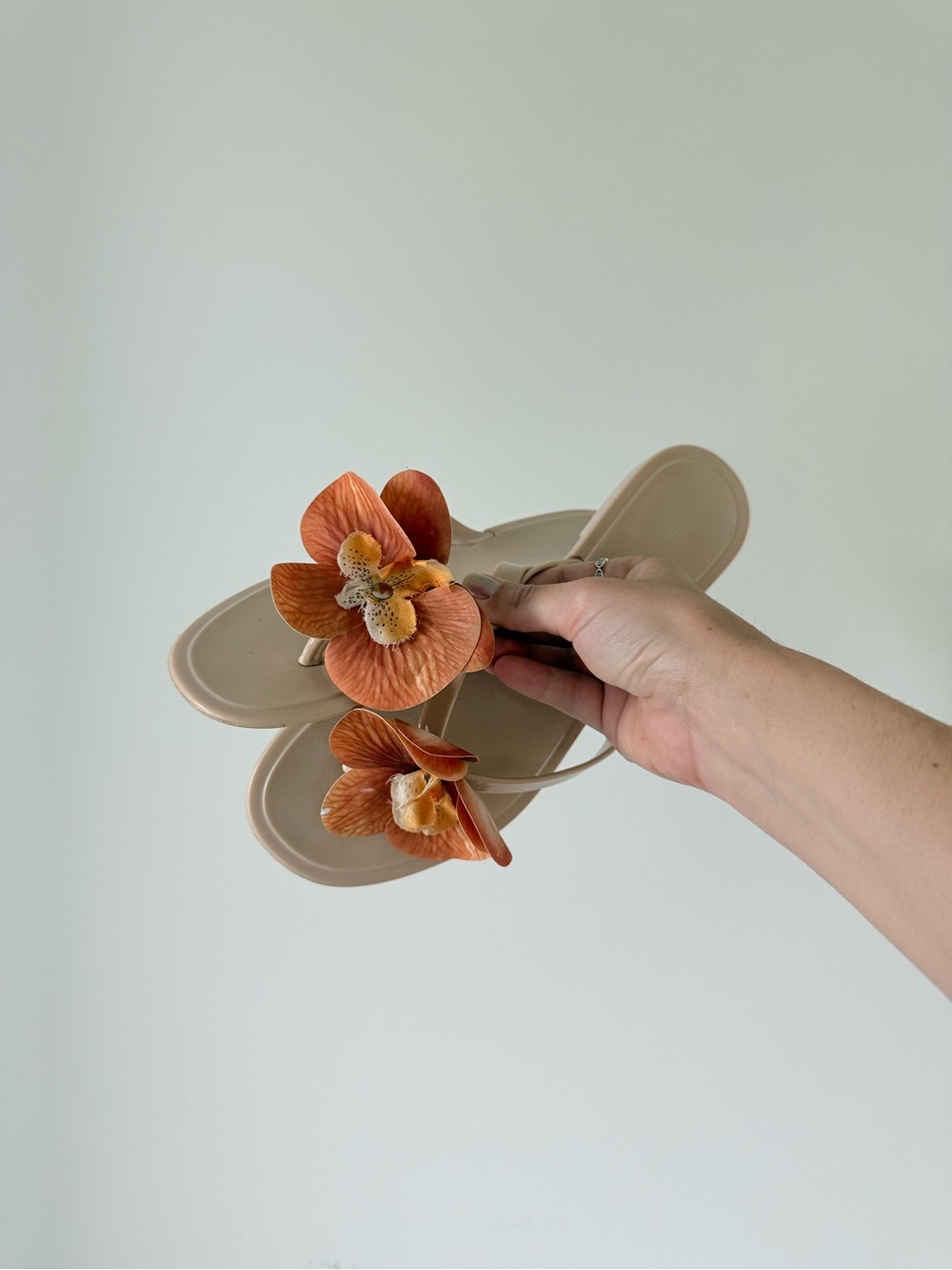 Neutral Floral Flip-Flop Sandals with Orange Flower Accent